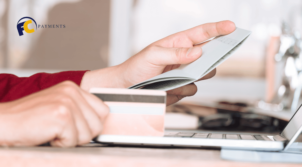 A person looking at a check and inspecting its details