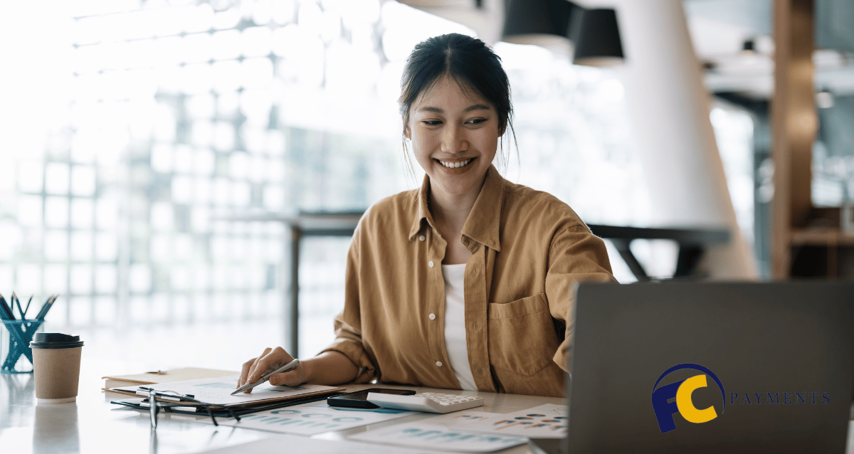 A person using a laptop to access their PayPal account and view use cases for personal and business accounts