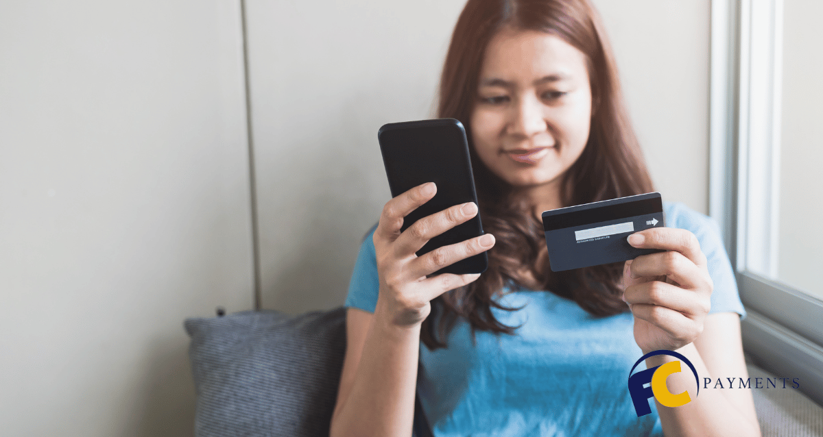 Two people discussing the fees and charges of a PayPal business account