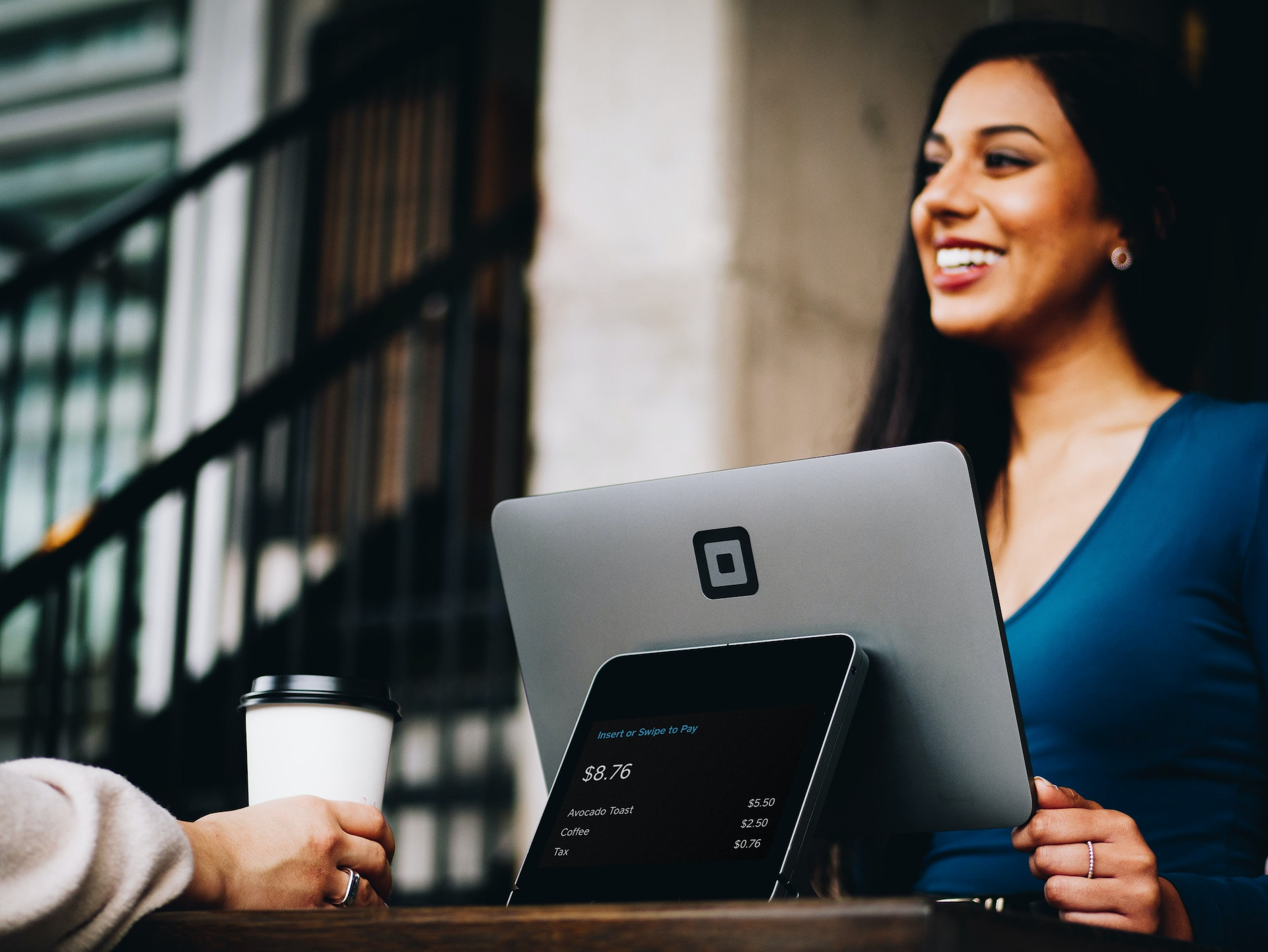 A person looking at a document with the PayPal Seller Protection logo